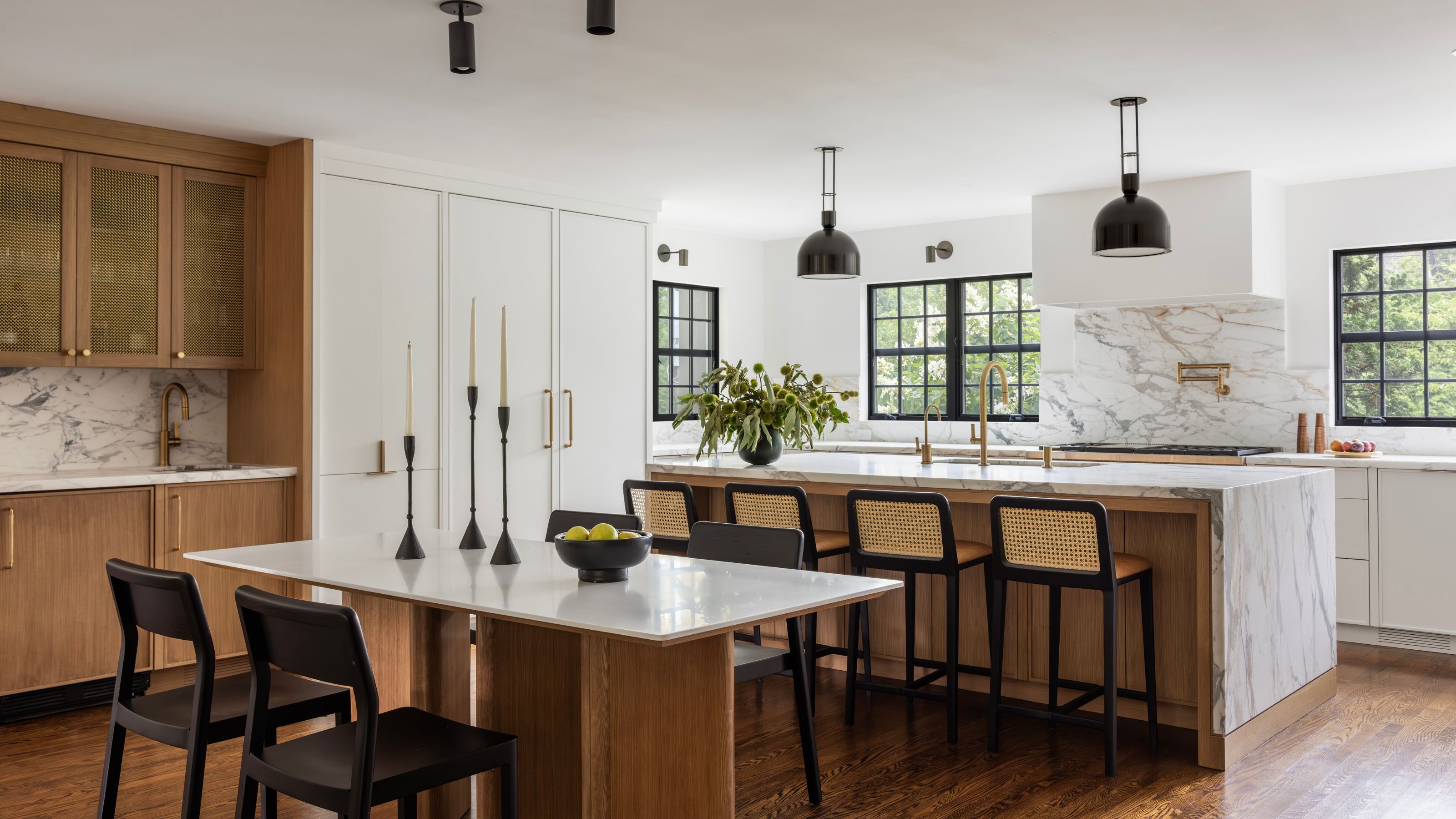 neutral kitchen with marble surfaces and wooden cabinetry