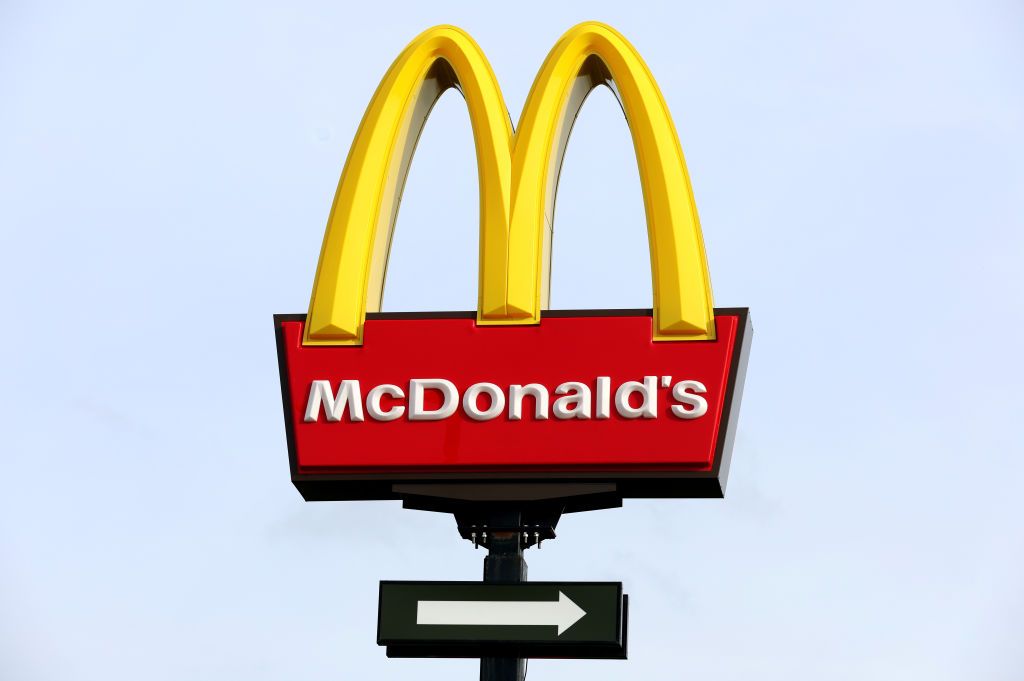 McDonald&#039;s logo displayed on tall pole outside of one of its stores