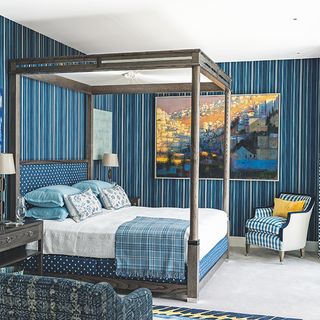 bedroom with four-poster bed and wallpaper