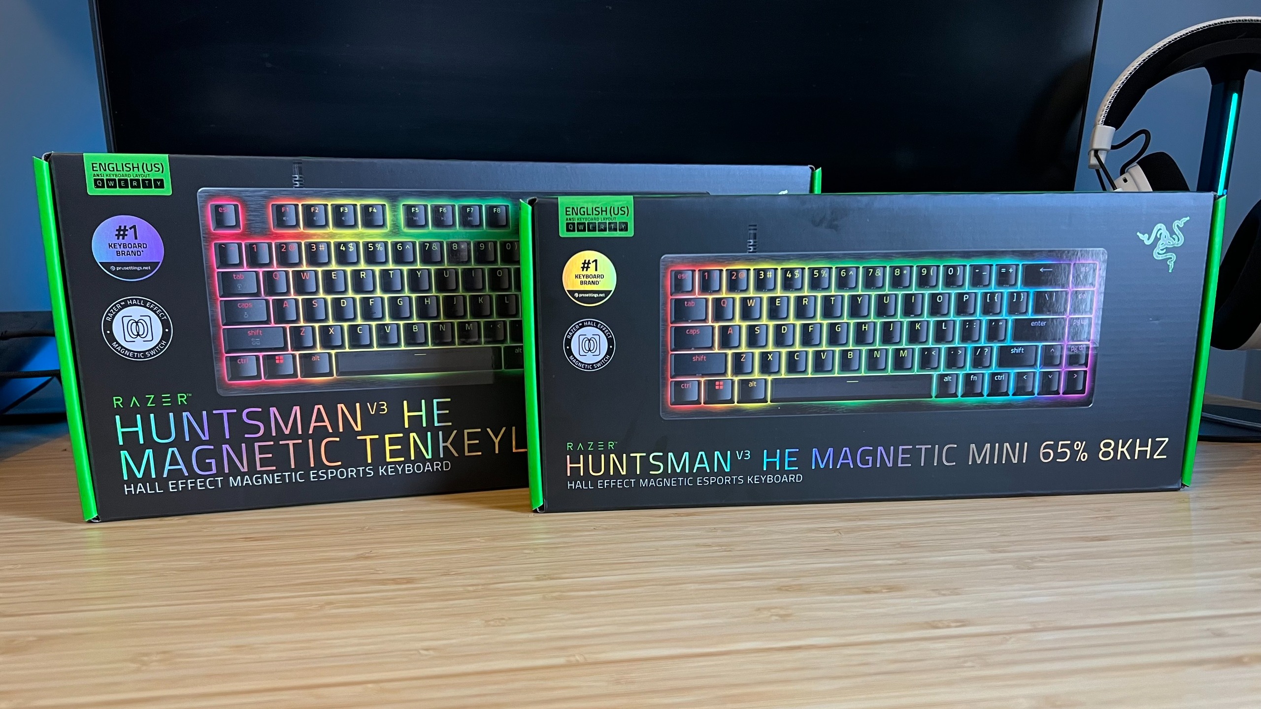 Razer Huntsman V3 HE TKL and 65% boxes on a wooden desk