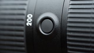 Image shows a Nikkor AF-S FX 70-200mm f/2.8 FL-ED VR function button
