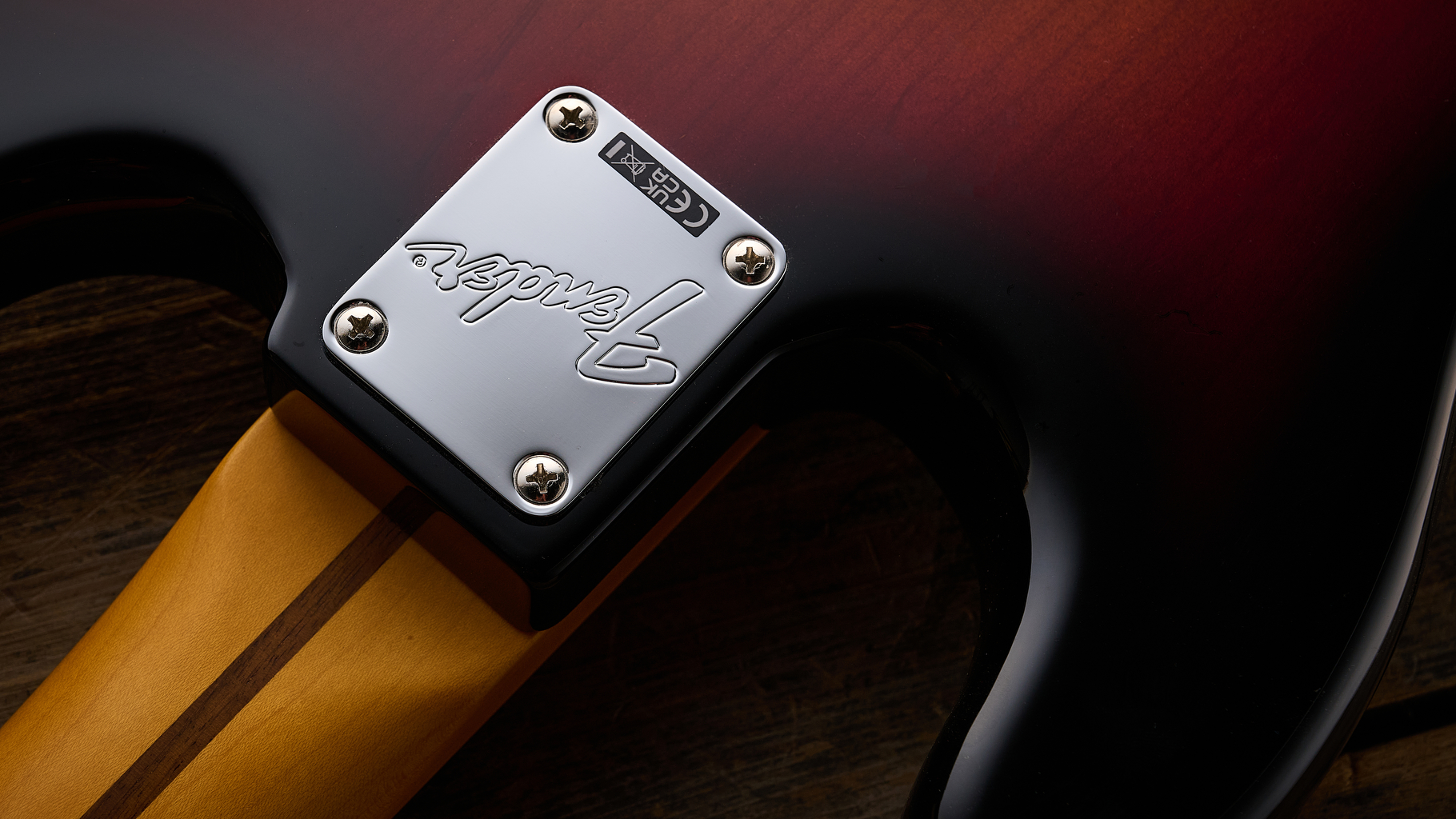 Fender American Professional Classic Precision Bass in 3-Color Sunburst shot on wood floor boards