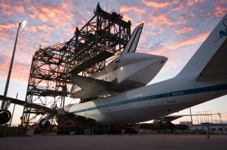 Space shuttle Endeavour is seen at the Kennedy Space Center in Florida atop NASA's modified Boeing 747 Shuttle Carrier Aircraft (SCA) at sunrise on Sunday, Sept. 16, 2012. 
