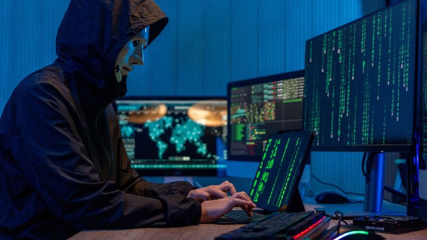 a scammer typing on a computer