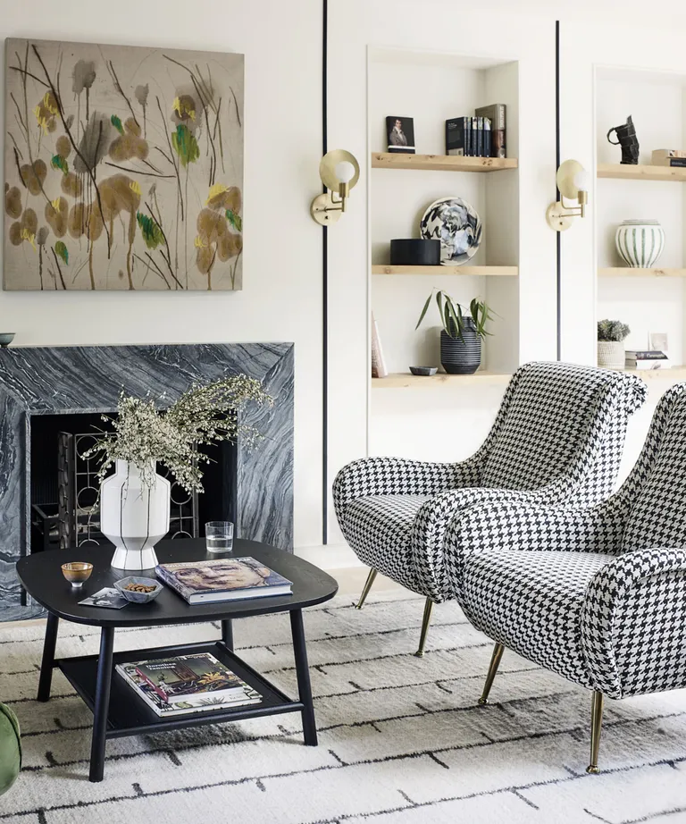 living room with black and white houndstooth check mid century armchairs in Victorian mews house in London with contemporary interior designed by Kitesgrove