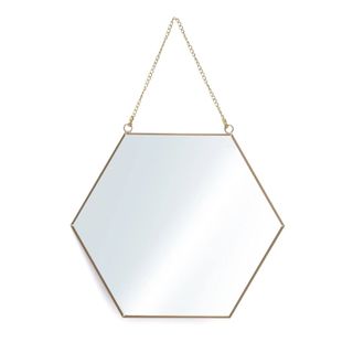 A gold hexagonal mirror