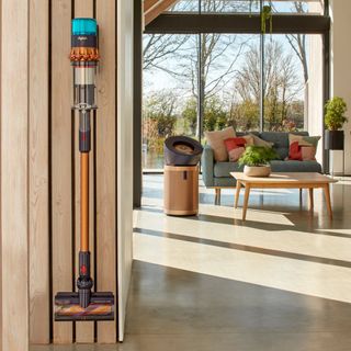 Dyson cordless vacuum hung on wall