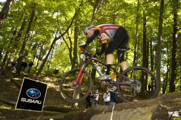 Mike Phillips (Adventure 212 / Specialized) rides off a log jump at WORS Wigwam MTB Challenge in Sheboygan. Phillips finished third at Sheboygan and in the 2009 WORS Series Overall.