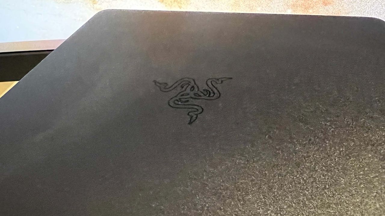 A Razer Leviathan V2 on a desk in front of a monitor