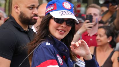 Kendall Jenner walks in Paris wearing a vintage inspired matching set and a sporty baseball cap