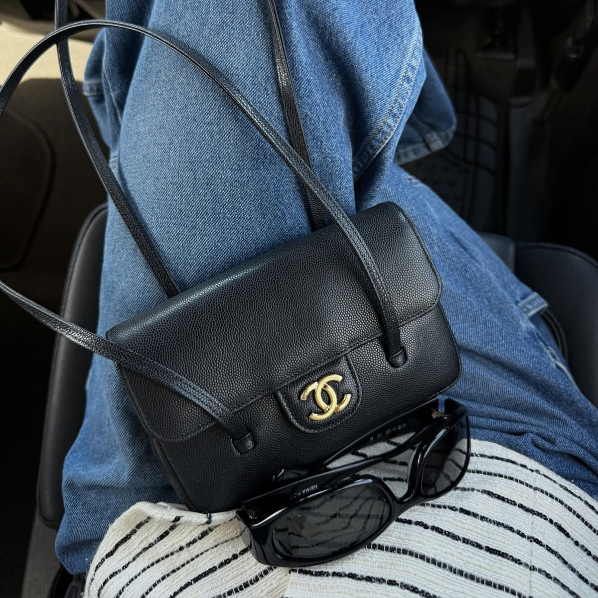 @hoskelsa closeup shot of chanel shoulder bag and sunglasses