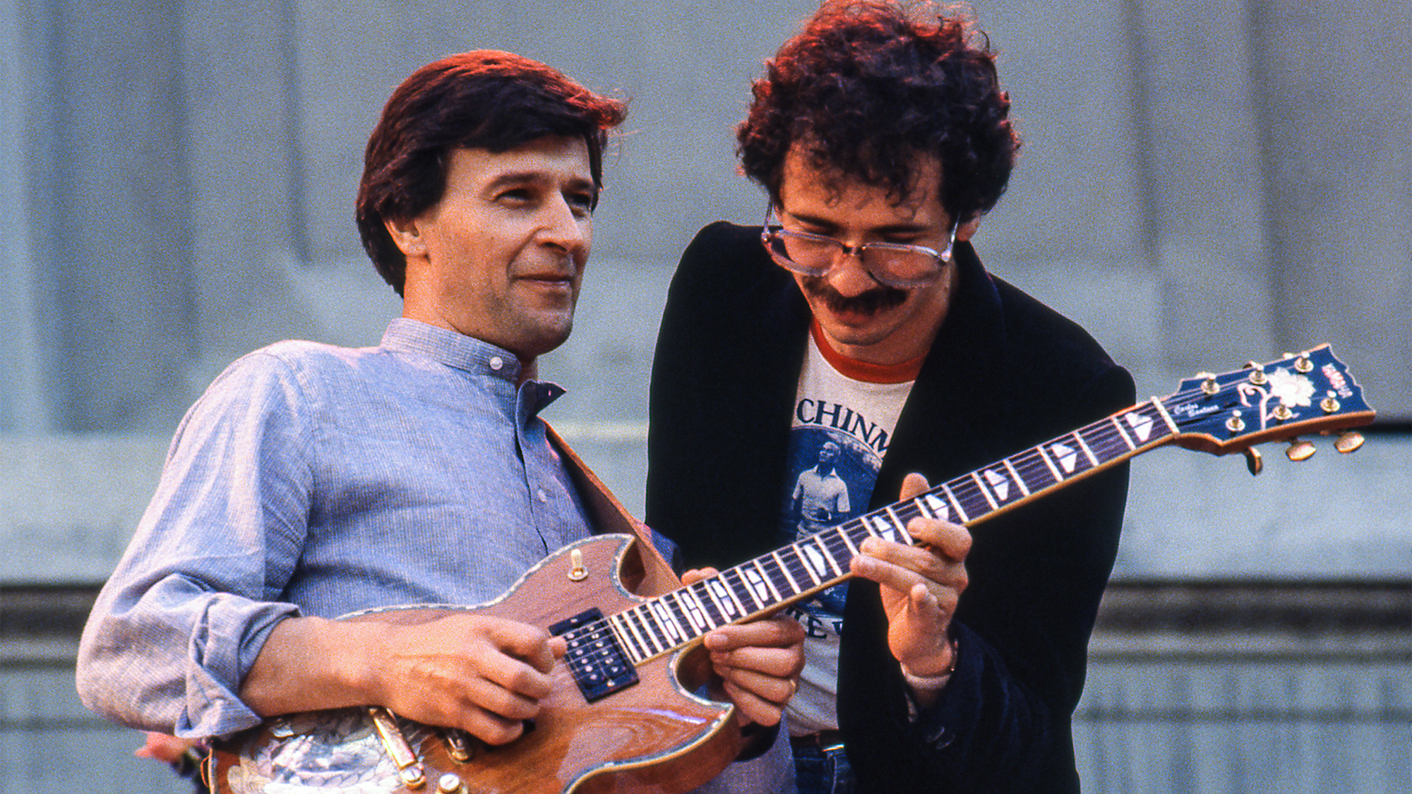John McLaughlin performs with Carlos Santana during the Berkeley Jazz Festival at the Greek Theatre in Berkeley, California on May 25, 1980.