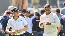 Justin Thomas (left) and Tiger Woods share a laugh at the 2024 Genesis Invitational