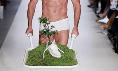Tree-sprouting shoes from Dutch designer OAT were shown off at the Green Fashion Awards runway by "Adam" and "Eve."