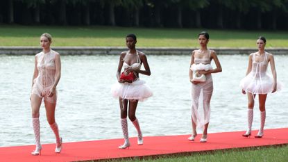 Gigi Hadid and models walk the runway during "Le Chouchou" Jacquemus' Fashion Show at Chateau de Versailles on June 26, 2023 in Versailles, France.