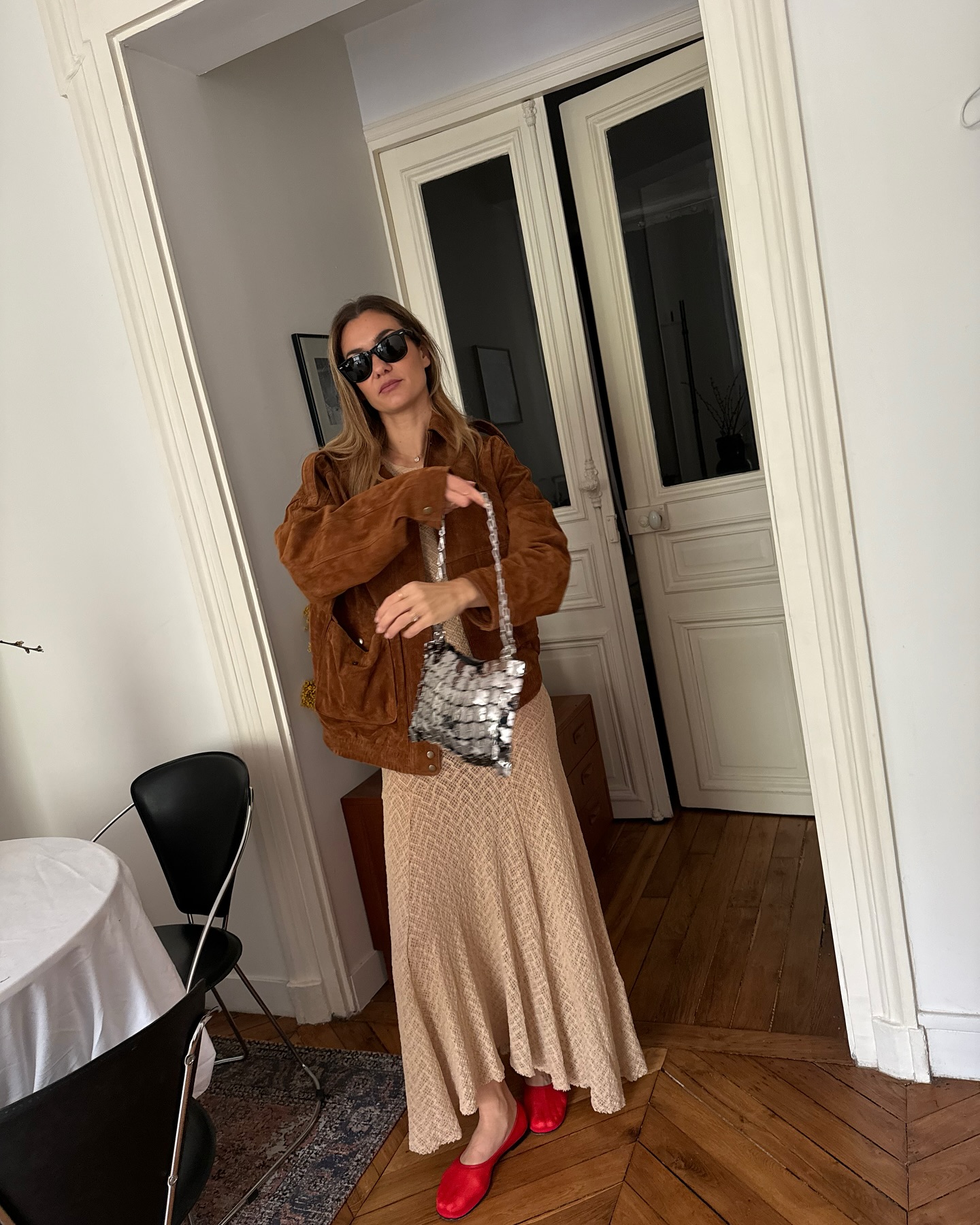 Anne-Laure Mais wears red mesh flats
