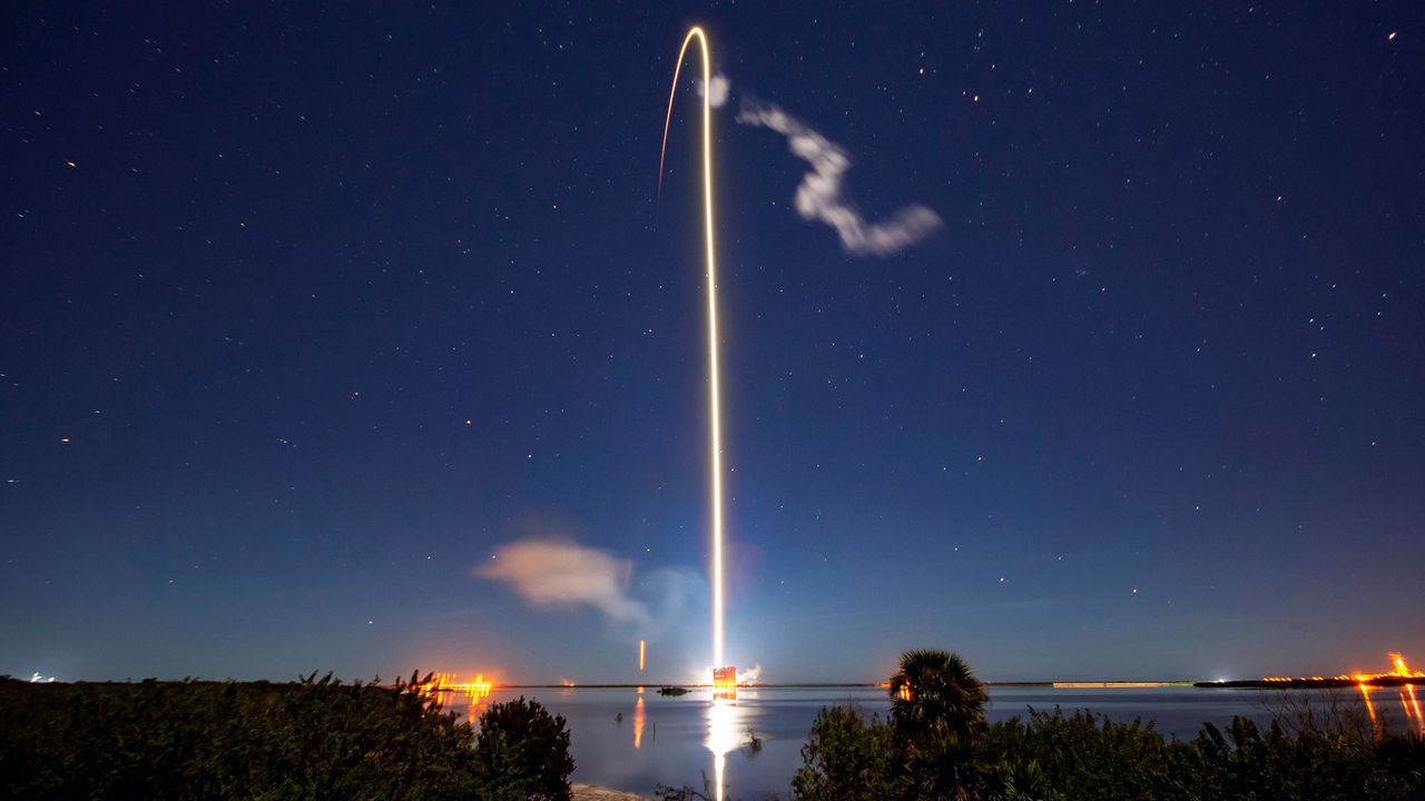 A SpaceX Falcon 9 rocket soars into space with 60 of the company's Starlink internet satellites in this long-exposure photo of the launch on Jan. 6, 2020. The rocket lifted off from Cape Canaveral Air Force Station in Florida at 9:19 p.m. EST (0219 GMT Tuesday) before returning to Earth for a drone-ship landing, marking the fourth time that this particular booster has flown.