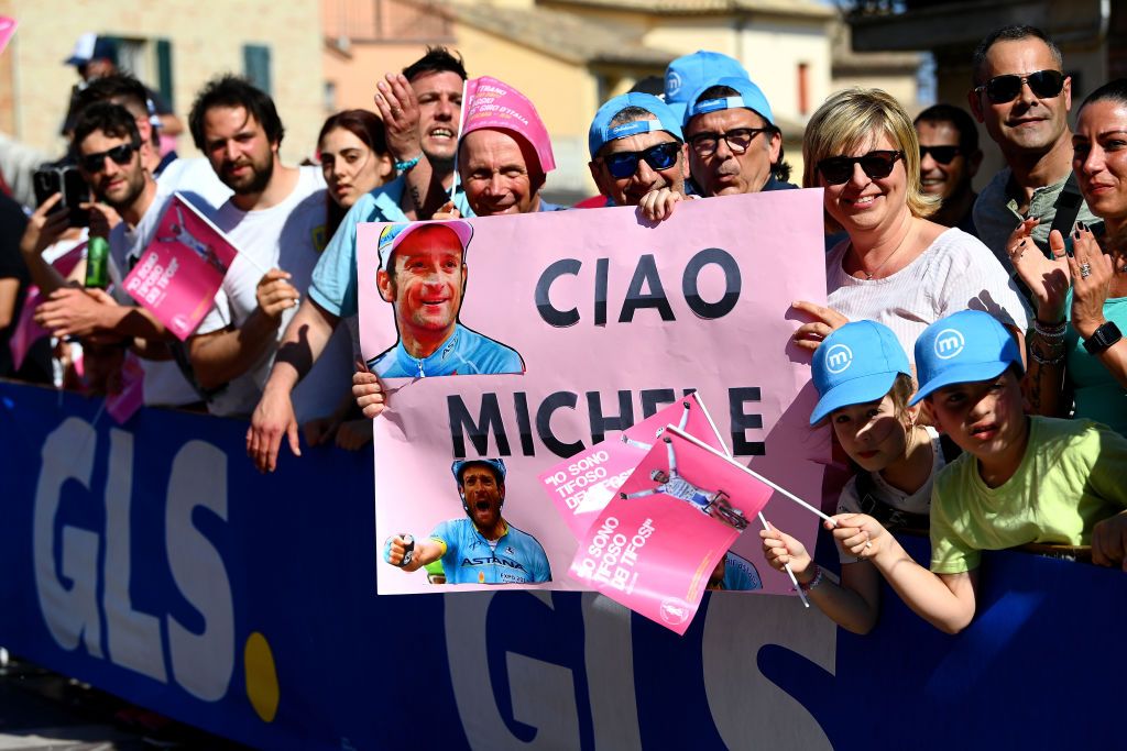 JESI ITALY MAY 17 Fans of Michele Scarponi wait for the peloton to pass during the 105th Giro dItalia 2022 Stage 10 a 196km stage from Pescara to Jesi 95m Giro WorldTour on May 17 2022 in Jesi Italy Photo by Tim de WaeleGetty Images