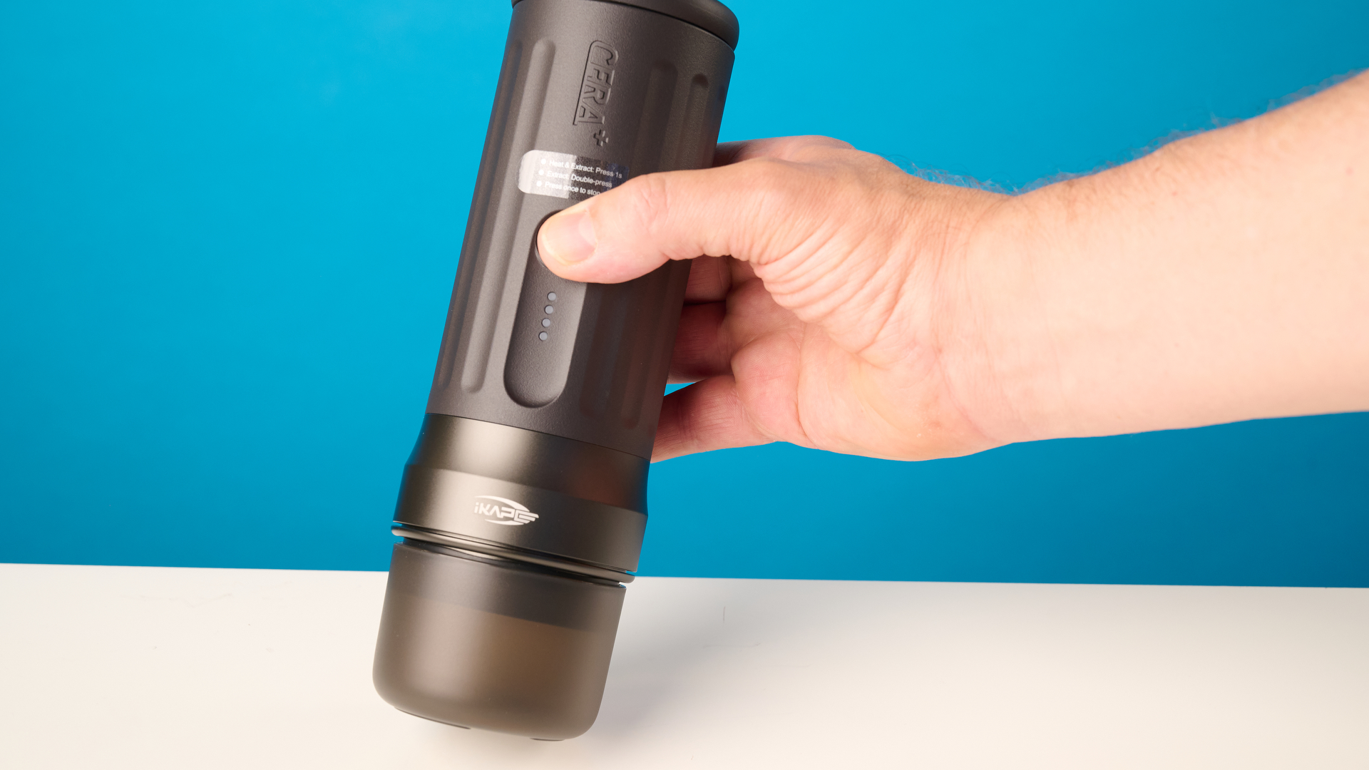 the ikape kapo k2 pro portable coffee maker against a blue background