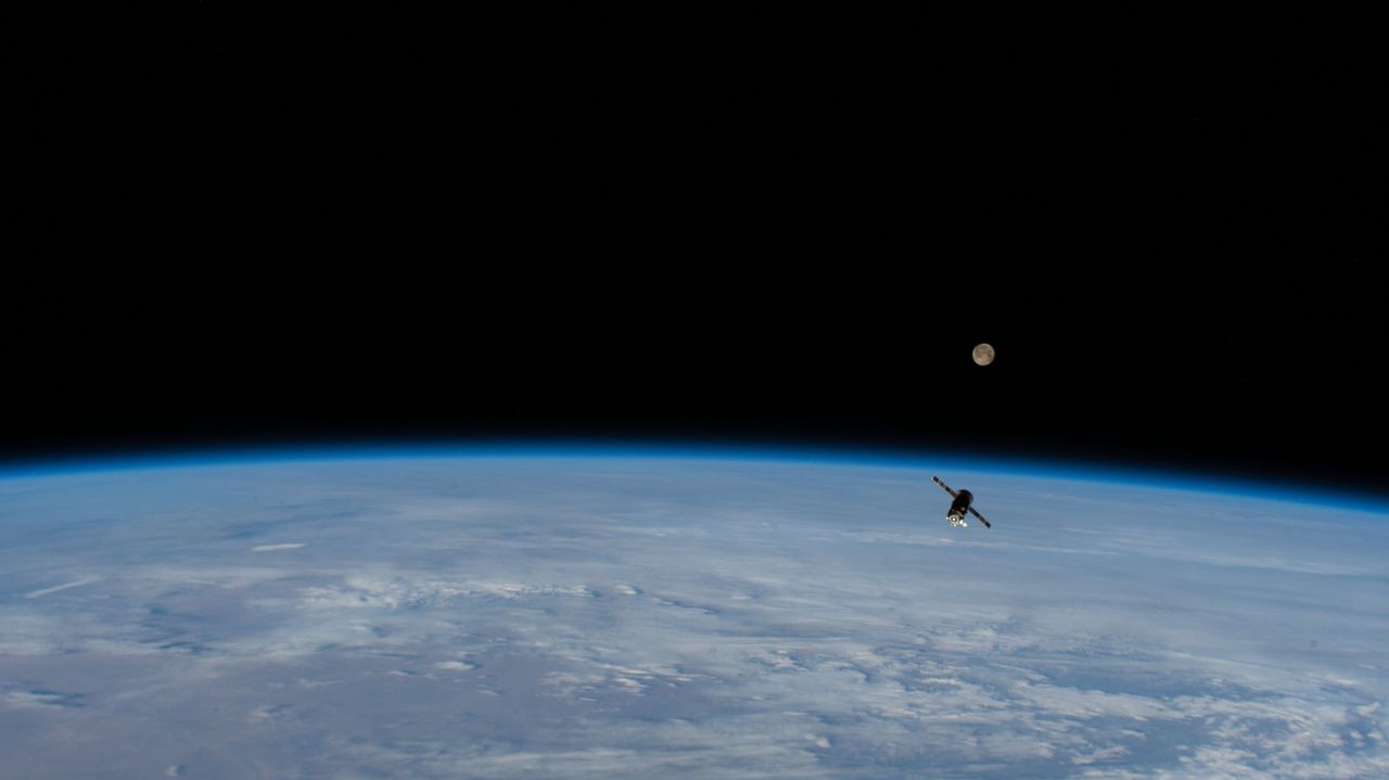 Russia's Progress 75 cargo resupply ship departs the International Space Station, filled with trash, as the Super Pink Moon glows in the background, on April 27, 2021.