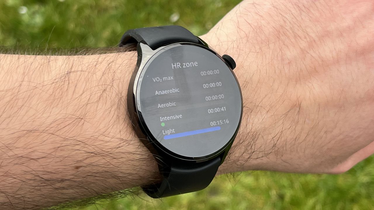 The Xiaomi Watch S1 Pro showing metrics from a workout, against a green background