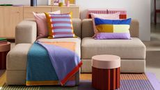 ikea sofa with colorful throw pillows