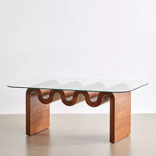 coffee table with curved wooden base and glass top
