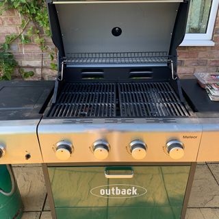 Green BBQ with lid open