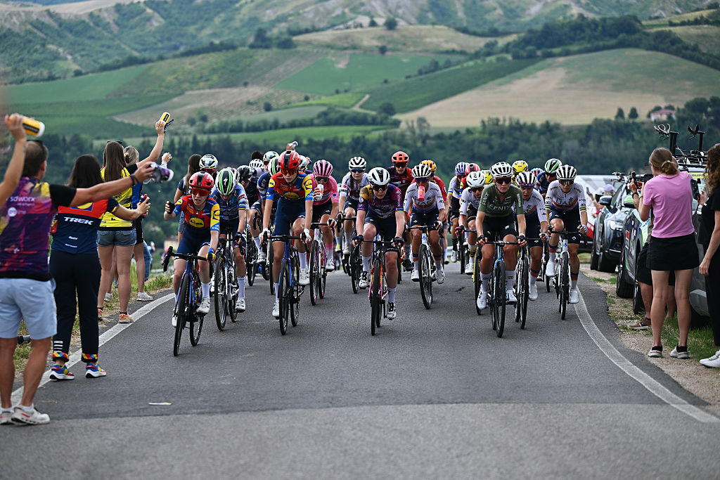IMOLA, ITALY - JULY 13: (L-R) Amanda Spratt of Australia, Isabella Holmgren of Canada and Team Lidl - Trek, Anna Van Der Breggen of Netherlands and Team SD Worx - Protime and a general view of the peloton passing the feed zone during the 36th Giro d'Italia Women 2025, Stage 8 a 134km stage from Forli to Imola / #UCIWWT / on July 13, 2025 in Imola, Italy. (Photo by Luc Claessen/Getty Images)