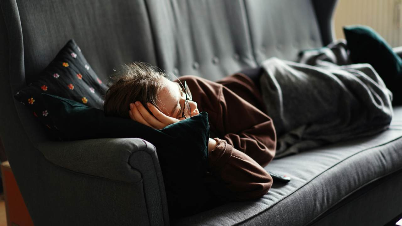 A woman having a nap on the sofa