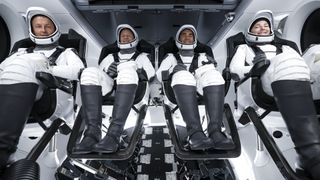 SpaceX's Crew-3 mission astronauts smile during a launch rehearsal inside their Crew Dragon Endurance capsule on Oct. 28, 2021 ahead of their launch to the International Space Station on Nov. 3, 2021.