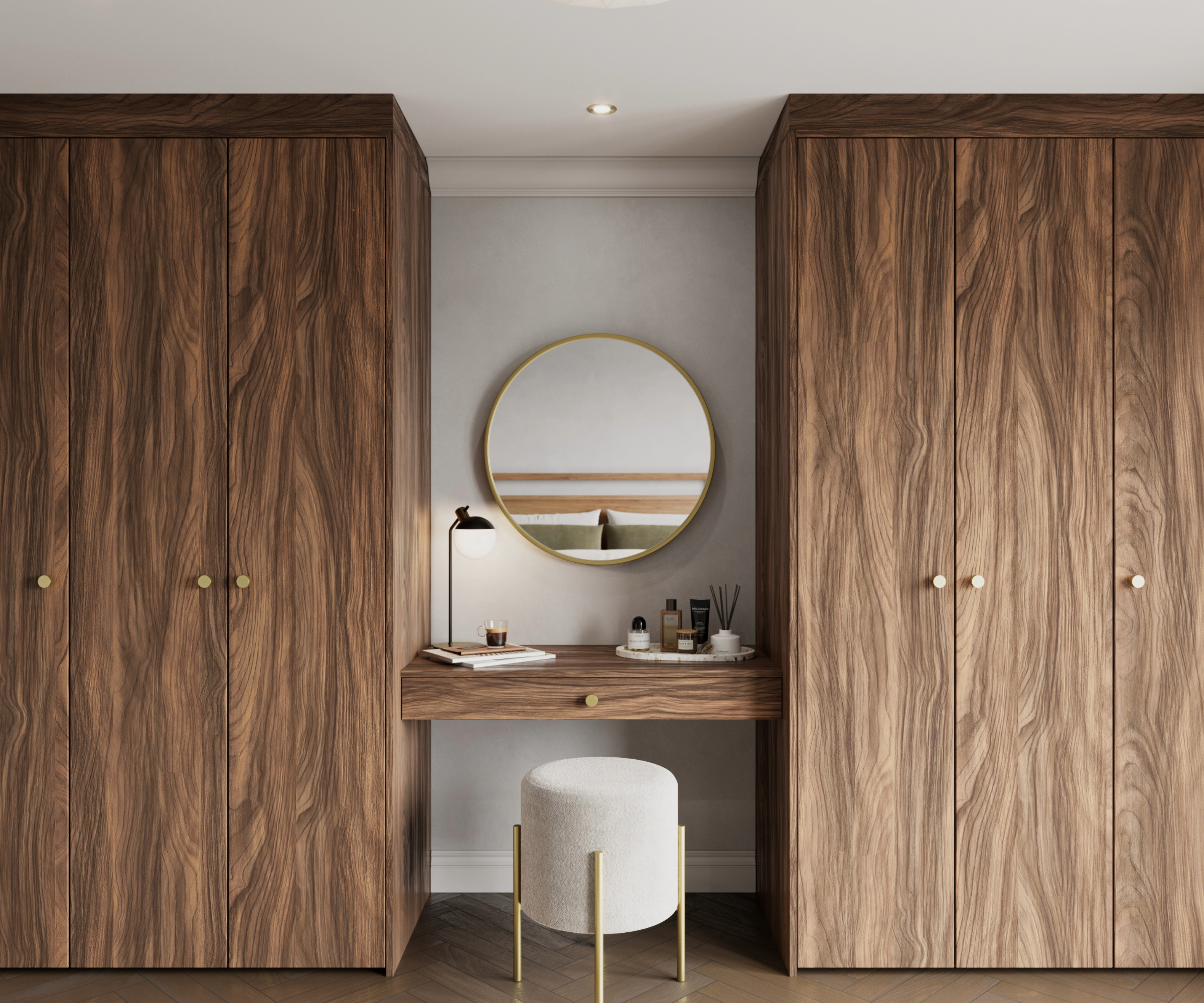 Dressing room with a vanity table in between two wardrobes