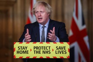 Boris Johnson leading a press conference in March 2021