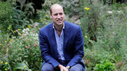 Prince William, Duke of Cambridge socially distances as he speaks with service users during a visit to the Garden House of the Light Project in Peterborough
