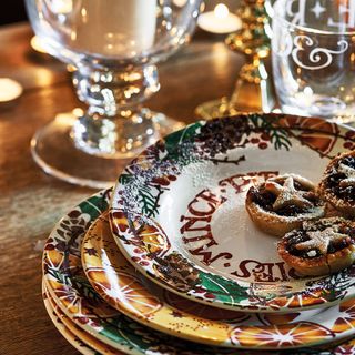 christmas decorative plates and glasses on table