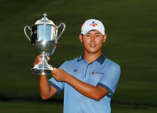 Si Woo Kim holds the Wyndham Championship trophy in 2016