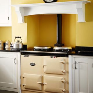 yellow kitchen with AGA stove