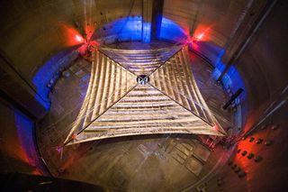 The fully deployed solar sail spans approximately a third the length of a football field.