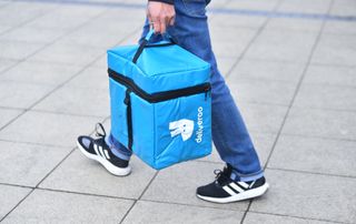 Person carrying a Deliveroo bag
