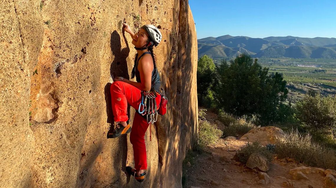 what is trad climbing: Jessie on a climb