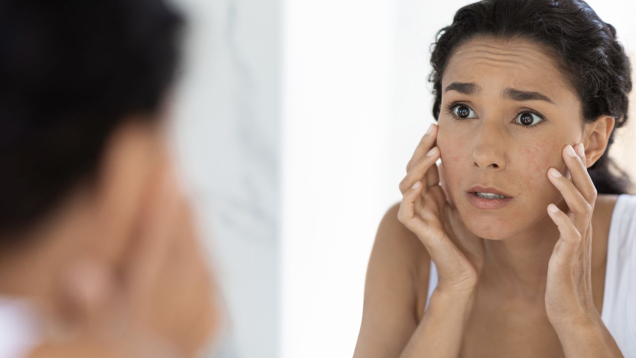 Woman looking in mirror