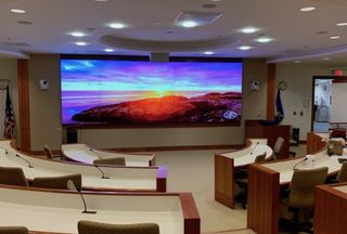 MITRE’s auditorium in Bedford, MA, with AV integration by HB Communications.