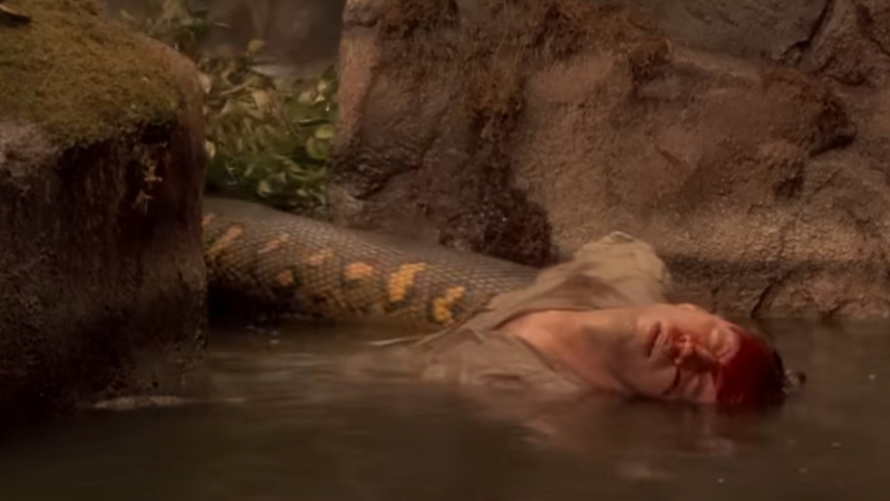 The anaconda pulling a dead body into the swamp in Anaconda