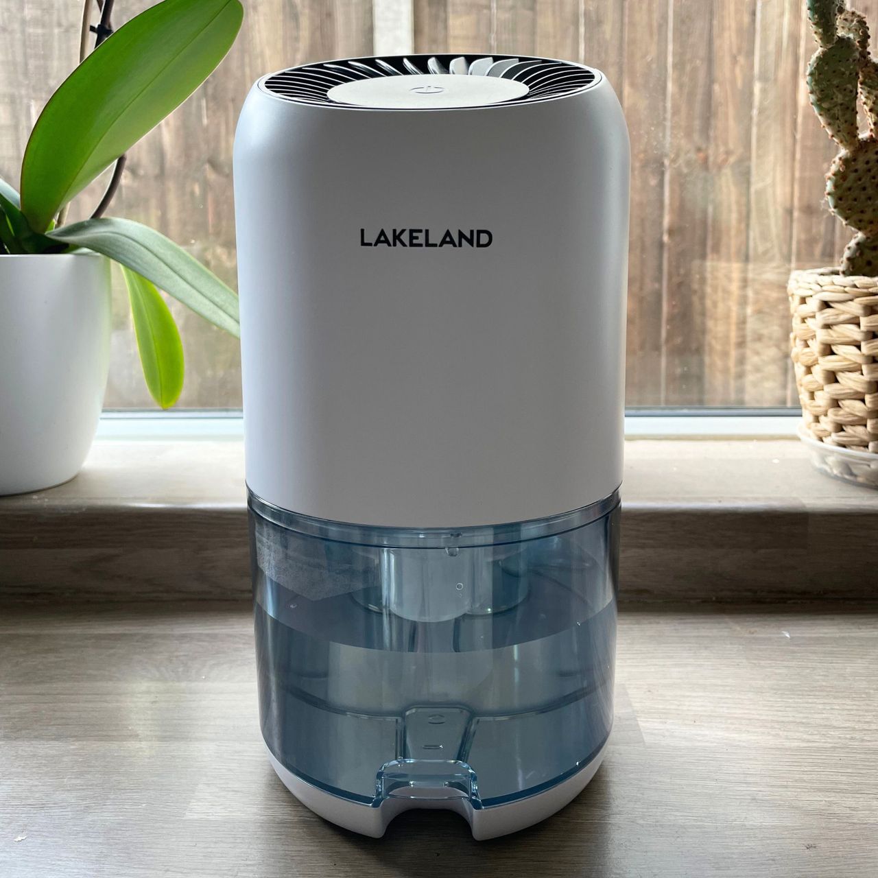 Lakeland dehumidifier on a kitchen worktop with plants behind it