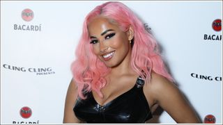 Amber Gill with pink hair as she attends Maya Jama's Annual Halloween Party Presented by BACARDÍ Rum at Oslo Hackney on October 28, 2022 in London, England.
