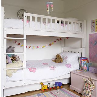 childs room with bunk bed and wooden flooring