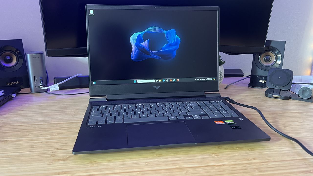 HP Victus gaming laptop on a wooden desk