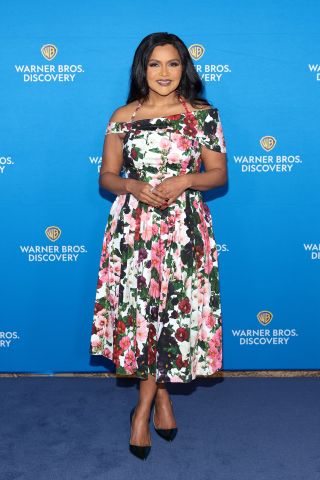 Mindy Kaling wearing a pink, white and green floral dress at the Warner Bros. Discovery Upfronts on May 15.