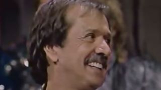 Close up of Sonny Bono singing on Late Night With David Letterman in the 1980s.