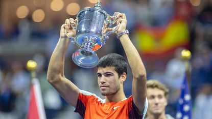 Carlos Alcaraz with the winners trophy after winning the US Open 